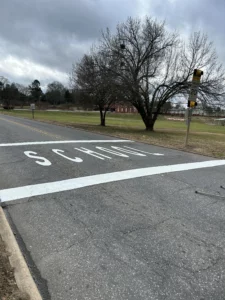 "SCHOOL" marked and striped for safety.