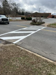 The crosswalk is clearly marked and striped.